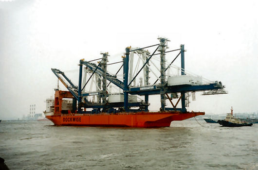 Dock Express 10 departing with 2 Hyundai container cranes