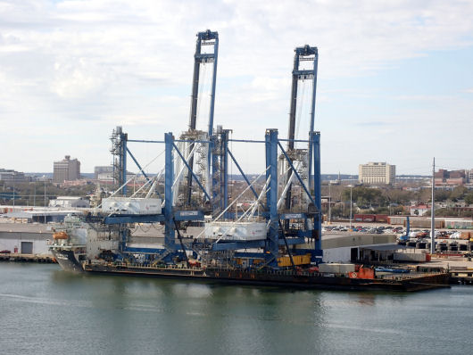 First crane being offloaded from barge