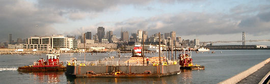 Barge maneuvered into drydock