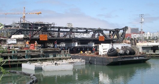 Lifting 4-th street bridge with barge