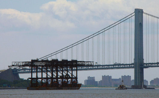 Barge loaded with cranes departs from Newark